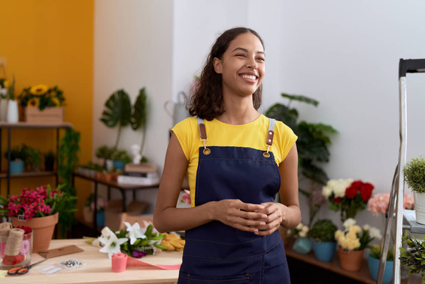 Young african american woman florist smiling confident standing at flower shop - Φωτογραφία, εικόνα