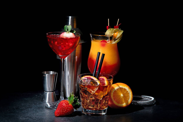 Set of various colorful cocktails on black background. Classic long drink cocktails menu concept.  - Fotó, kép
