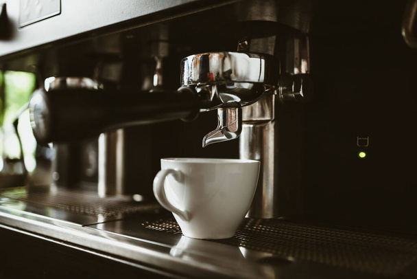 espresso machine in coffee shop counter offering freshly brewed coffee. coffee maker concept. - Photo, Image