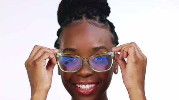 Black woman, vision and glasses, face and fashion, designer frame and fun, prescription lens isolated on white background. Happy female, laugh and pose in portrait with optometry, style and eye care. - Imágenes, Vídeo