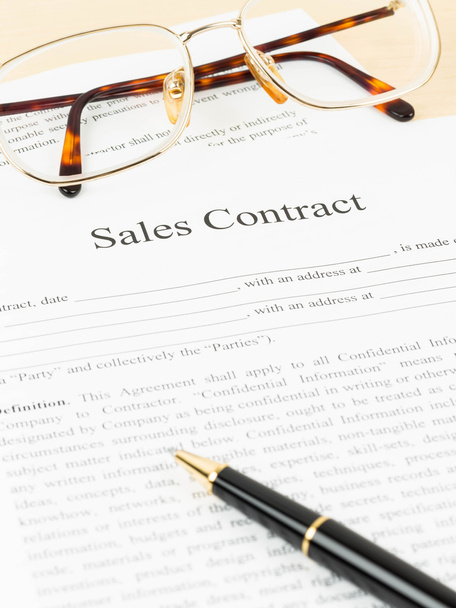 Sales contract document with glasses and pen - Photo, Image