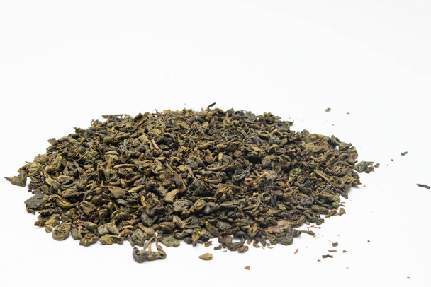 Heap of dry green tea on a white background - Foto, Imagen