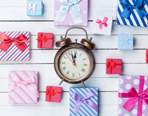 Gift boxes and alarm clock  - Фото, изображение