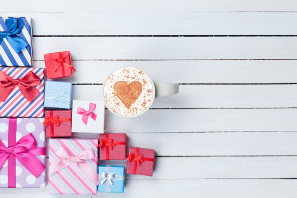 Cup of Cappuccino and gift boxes - 写真・画像