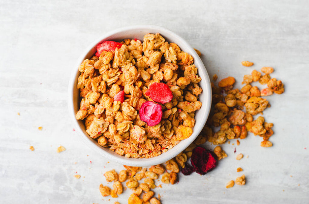 Granola with Dried Berries on Bright Background, Healthy Breakfast - Foto, afbeelding