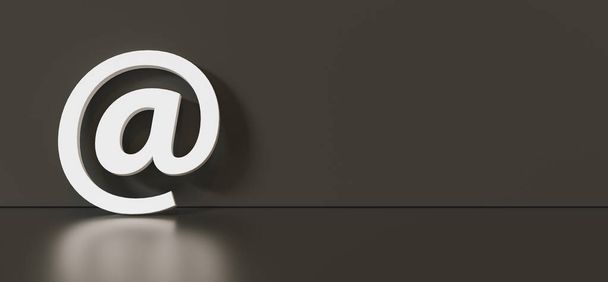 Icono de correo electrónico o en señal apoyada en una pared negra como concepto de comunicación, espacio de copia para su texto individual.  - Foto, imagen