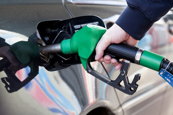 Man filling up car with fuel at petrol station - Фото, зображення