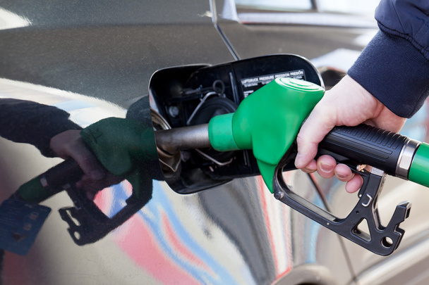 Man filling up car with fuel at petrol station - Фото, зображення