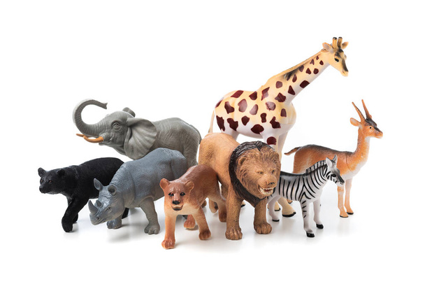 Group of jungle animals toys isolated over white background. Plastic animals toys. - Photo, image