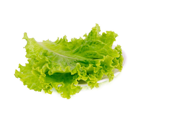 Green lettuce lying on the plate - Photo, Image