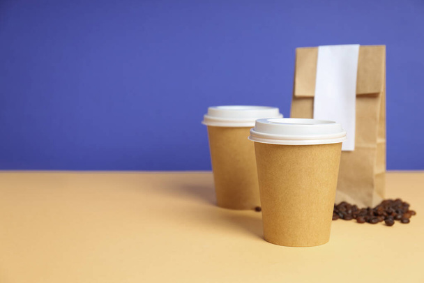 Blank paper cups, composition for delivery and take away concept, space for text - Fotoğraf, Görsel