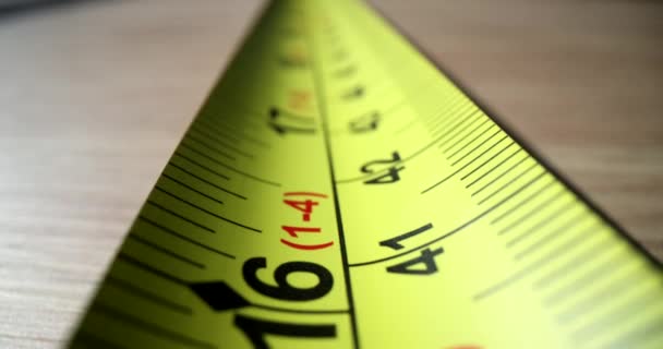 Yellow steel construction tape close-up. Measuring length and distance ruler concept - Footage, Video