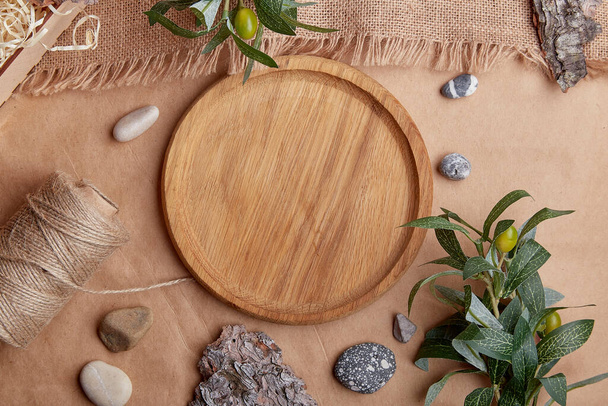 Aesthetic wooden mock up, template tray, brown natural sustainable products. Natural tree bark, green leaves, pebbles. - Photo, Image
