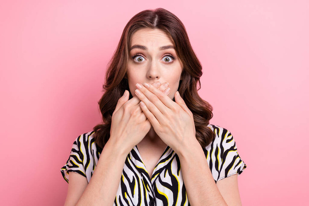 Portrait of impressed confused person hands cover mouth staring isolated on pink color background. - 写真・画像