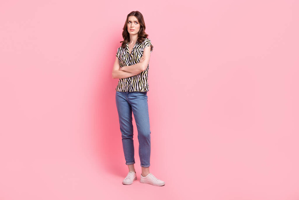 Full size portrait of unsatisfied gloomy girl crossed arms look empty space isolated on pink color background. - Foto, Bild