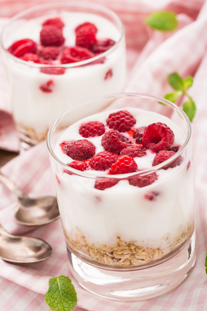 Yogurt with muesli and raspberries - Фото, зображення