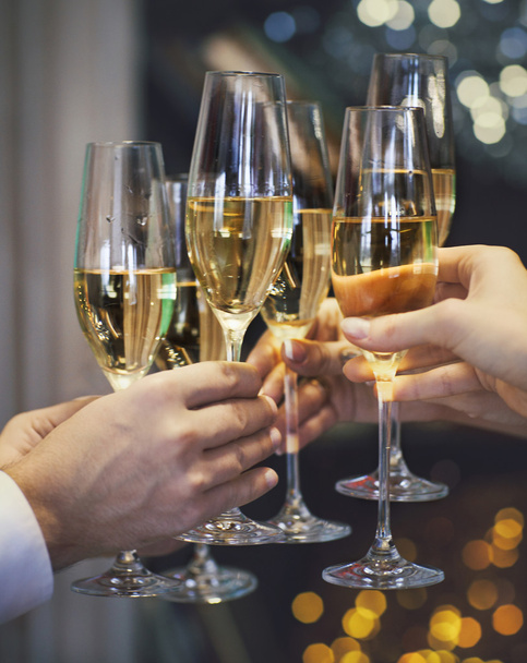 People holding glasses of champagne making a toast - Фото, изображение