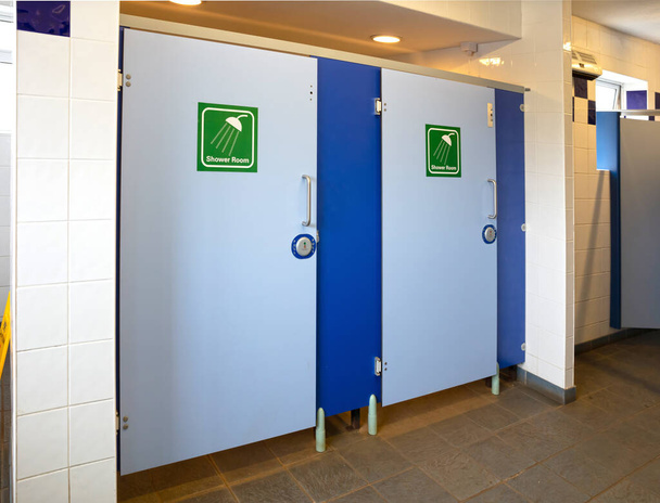 Public showers with two doors, selective focus - Photo, Image