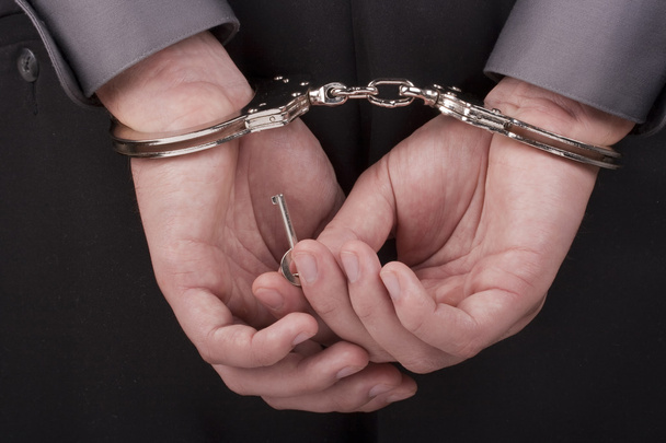 Arrested in handcuffs - Foto, imagen
