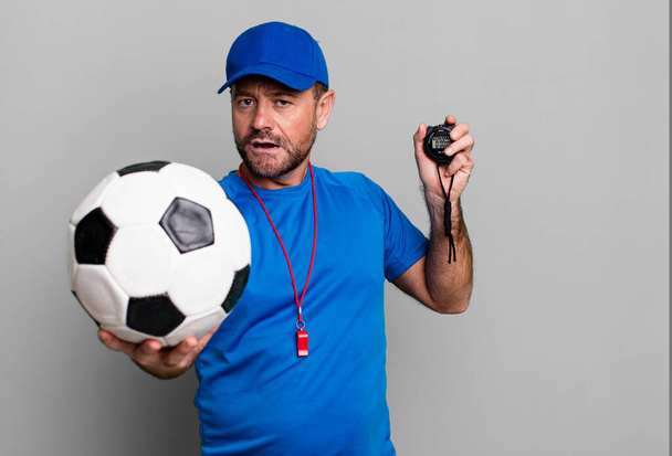 middle age man sport coach concept with a soccer ball - Foto, Imagem