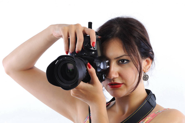 close view of young woman with dslr camera - Fotografie, Obrázek