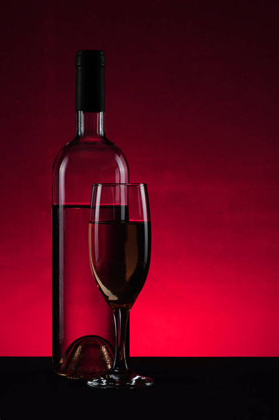 glass with red wine, bottle and wineglass - Foto, imagen
