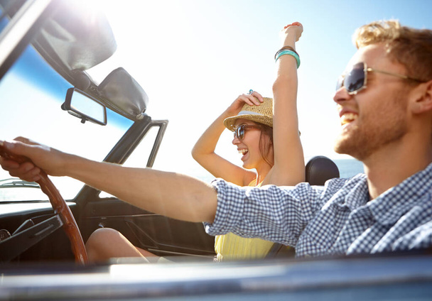 Travel, car road trip and profile couple on bonding holiday adventure, transportation journey or fun summer vacation. Love flare, convertible automobile and happy driver driving on Canada countryside. - Photo, Image