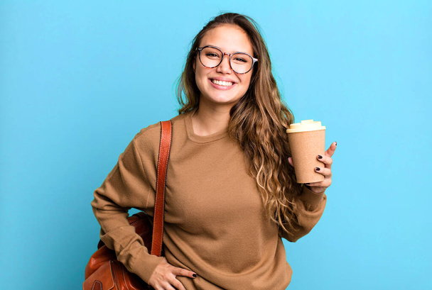 hispanic pretty woman smiling happily with a hand on hip and confident. take away coffee concept - Foto, imagen