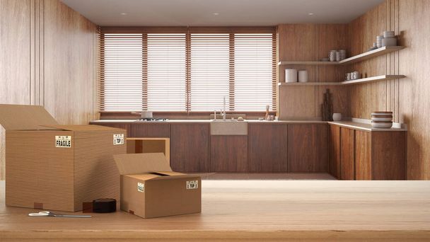 Деревянный стол, письменный стол или полка со стопкой картонных коробок над деревянной кухней в стиле джапанди, минималистский дизайн интерьера, движущаяся концепция дома с копировальным пространством - Фото, изображение