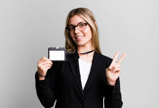 young pretty woman with an accreditation id pass card - Фото, зображення