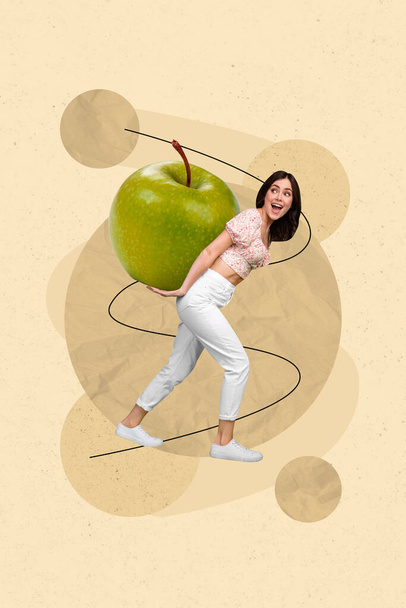 Photo of funny young overjoyed positive girl drag huge green fresh apple juice sweet dessert healthy food concept isolated on beige background. - Fotografie, Obrázek
