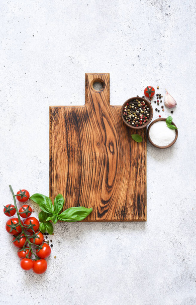 Various spices, cherry on the kitchen board. Copy space for text. Food, kitchen ingredients for cooking.  - Foto, Bild