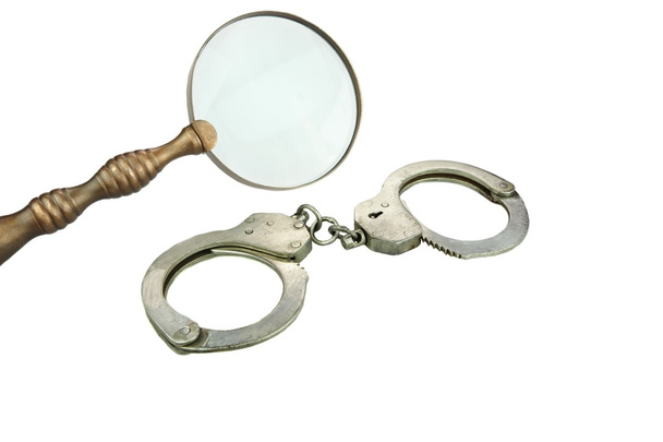 Retro Magnifying Glass and Handcuffs - Photo, Image