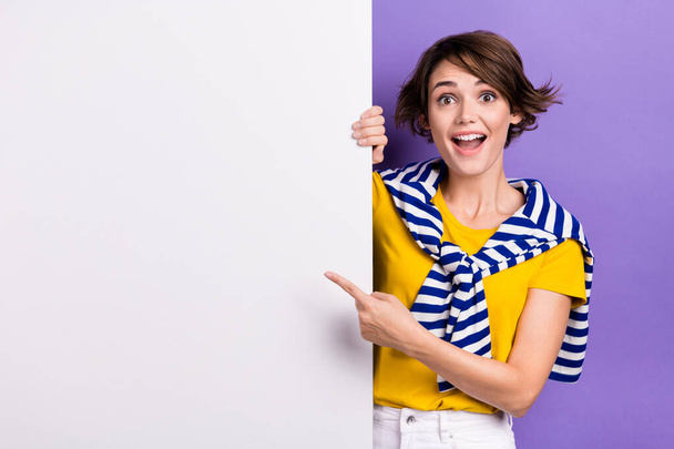 Photo of cheerful excited lady trendy tied striped pullover arm direct empty space positive feedback isolated on purple color background. - Φωτογραφία, εικόνα