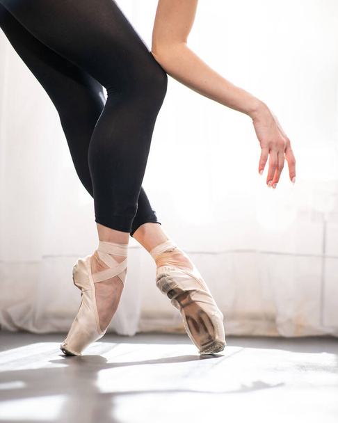 Close-up of the legs and arms of a ballerina - Photo, image
