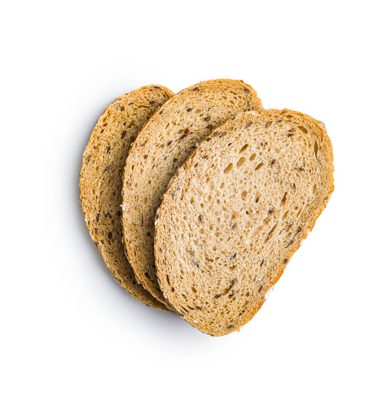 Sliced whole grain bread. Tasty wholegrain pastry with seeds isolated on the white background. - Foto, imagen