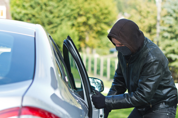 Thief stealing a car - Фото, зображення