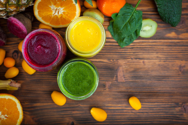 Blended green,yellow and purple smoothie with ingredients select - Φωτογραφία, εικόνα
