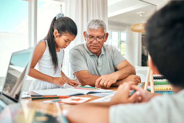 Education, learning and family together with homework, academic material and senior man with children studying. Grandfather helping kids, learn and development with growth, study and school. - Photo, Image