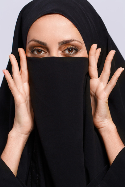 Beautiful Muslim woman looking at camera - Photo, image