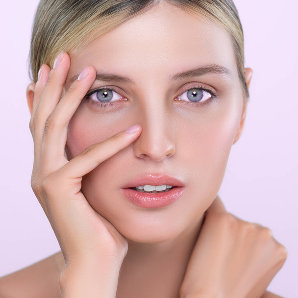 Closeup alluring beautiful woman with perfect smooth and clean skin portrait in isolated background. Beauty hand gesture with expressive facial expression for skincare treatment product or spa. - Photo, image