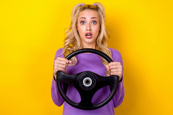 Photo of funky impressed woman wear violet shirt driving car getting crash accident isolated yellow color background. - Foto, immagini