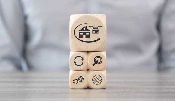 Wooden blocks with symbol of drone delivery concept - Foto, afbeelding
