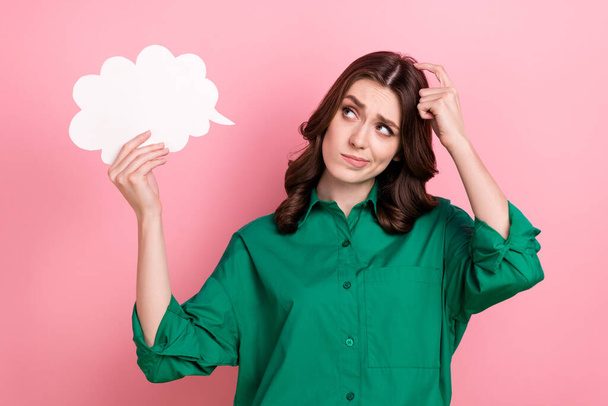 Portrait of minded thoughtful clever girl with curly hairstyle wear green shirt look at mind cloud finger head isolated on pink background. - Фото, зображення
