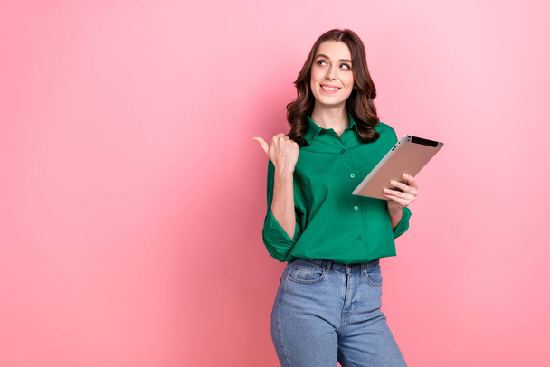 Portrait of positive cheerful hr recruiter girl hold tablet look direct finger empty space isolated on pink color background. - Valokuva, kuva
