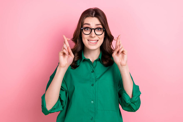 Photo of worried corporate person biting lips crossed fingers pray hope isolated on pink color background. - Photo, image