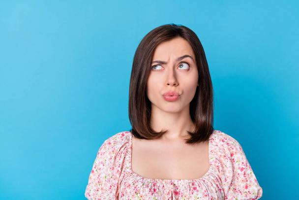 Closeup photo of young genius smart cute woman wear top look empty space minded funny interesting deal isolated on blue color background. - 写真・画像