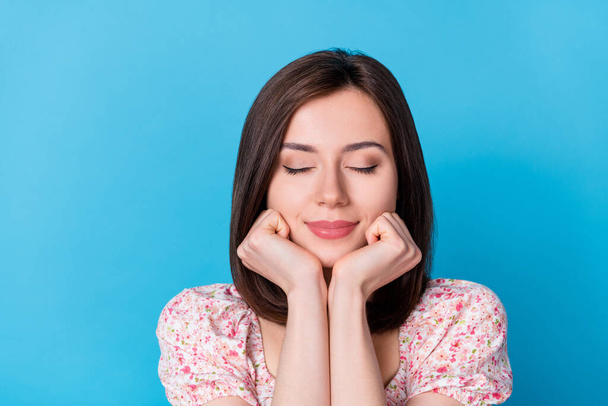 Closeup photo of young dreamy sleeping woman hold cheeks happy positive isolated on blue color background. - Foto, Imagen