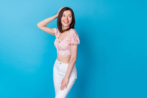 Portrait photo of young attractive gorgeous woman posing look empty space smiling positive date isolated on blue color background. - Zdjęcie, obraz