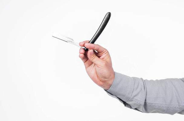 retro razor blade in hand of professional hairdresser isolated on white, barbering. - Foto, Bild